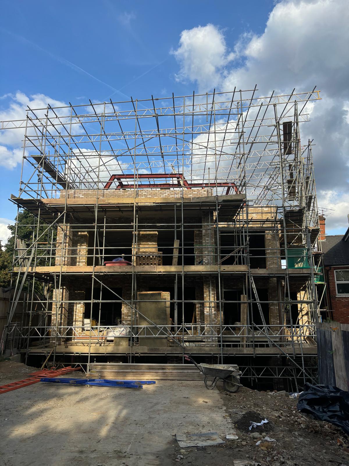 New build twin homes with multi-lift scaffold
